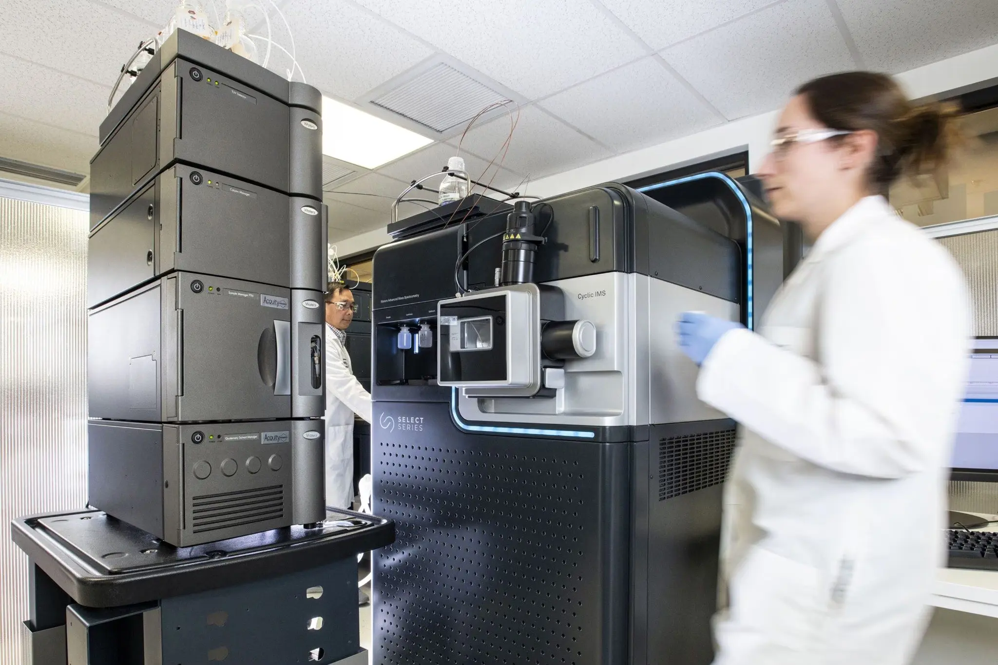 Women walking fast in a lab